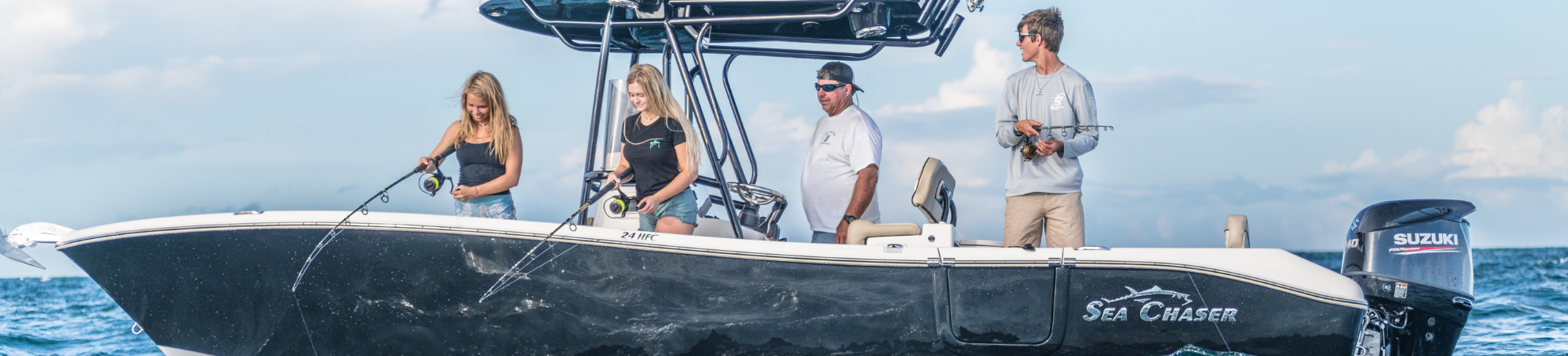 Sea Chaser 24 HFC boat on the water with family of four fishing