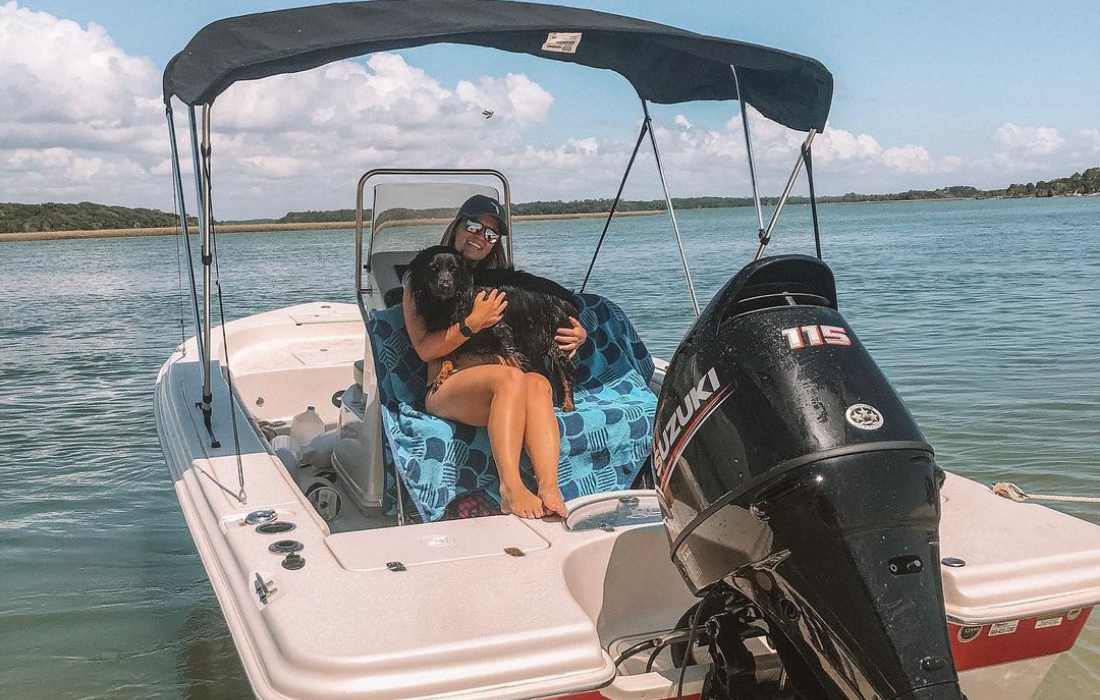 Customer Profile, Lauren With Her Dog On Sea Skiff